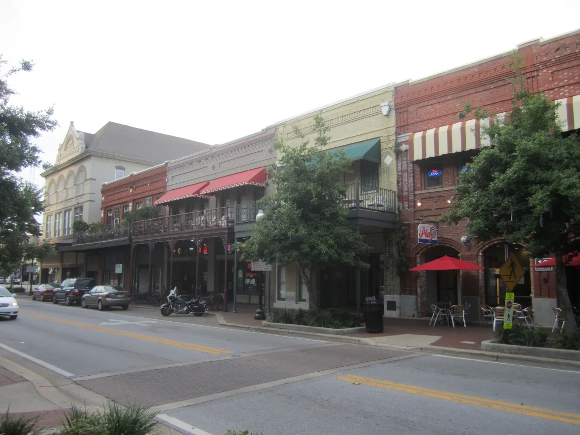 Brick storefronts and balconies along South Palafox Street in downtown Pensacola