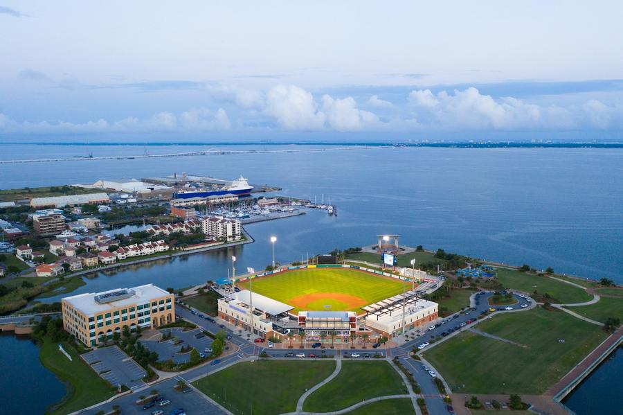 Aerial view of downtown Pensacola waterfront with a ballpark, port, marina and Pensacola Bay beyond